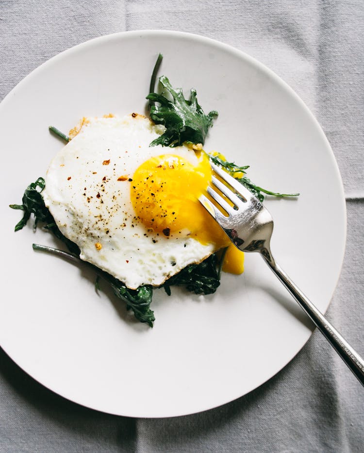 Best Sauteed Baby Kale with Eggs OverEasy Recipe The Yellow Table